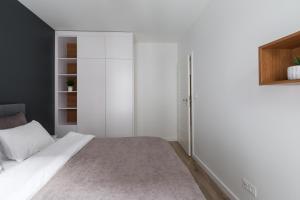 Łóżko lub łóżka w pokoju w obiekcie Luksusowy apartament przy Targach