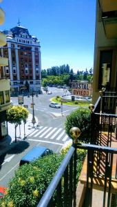 a view of a street from a balcony of a building at HOSTAL OVIEDO in León