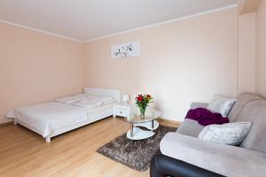 Posteľ alebo postele v izbe v ubytovaní ApartHouse Apartamenty Centrum