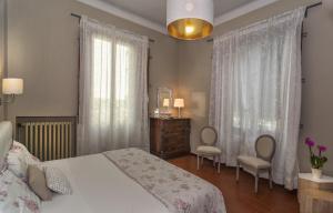 Postel nebo postele na pokoji v ubytování Villa Ricci Suites