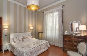 Postel nebo postele na pokoji v ubytování Villa Ricci Suites