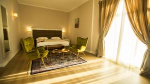 Postel nebo postele na pokoji v ubytování Royal Hill Hotel