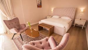 Postel nebo postele na pokoji v ubytování Royal Hill Hotel