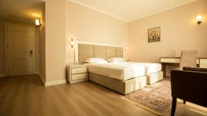 Postel nebo postele na pokoji v ubytování Royal Hill Hotel