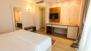Postel nebo postele na pokoji v ubytování Royal Hill Hotel