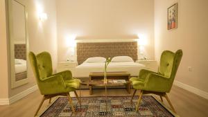Postel nebo postele na pokoji v ubytování Royal Hill Hotel