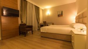 Postel nebo postele na pokoji v ubytování Royal Hill Hotel