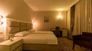 Postel nebo postele na pokoji v ubytování Royal Hill Hotel