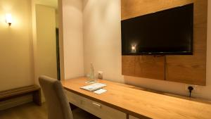 TV a/nebo společenská místnost v ubytování Royal Hill Hotel