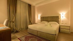 Postel nebo postele na pokoji v ubytování Royal Hill Hotel