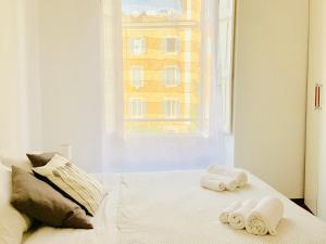 Кровать или кровати в номере Le Rondini a Roma