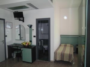 TV a/nebo společenská místnost v ubytování Hotel Palm Beach