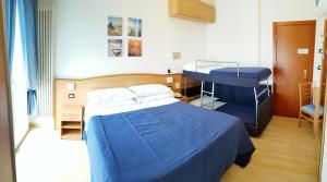 a hospital room with a bed and a table at Hotel Mare Blu -- boutique in Pineto