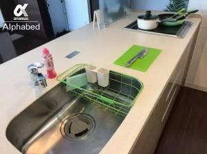 a kitchen sink with a dish drying rack on it at Alphabed TakamatsuFurujinmachi 901 / Vacation STAY 21909 in Takamatsu