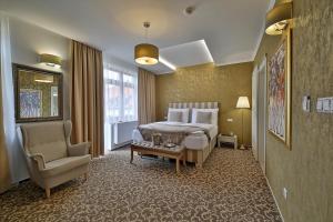 Postel nebo postele na pokoji v ubytování Hotel Pod Bránou