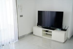 a flat screen tv sitting on a white entertainment center at Luxury Villa in Los Cristianos in Arona