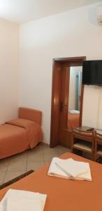 TV a/nebo společenská místnost v ubytování Hotel Arcella