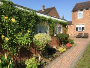 a house with a garden in front of it at Cannock Chase Guest House Self Catering incl all home amenities & private entrance in Cannock