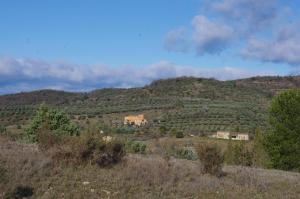 a house on the side of a hill at Pontet-Fronzèle agrotourisme ecologique, maison d'hôtes & Spa in Lagorce