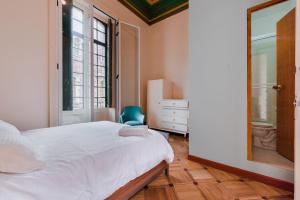 Postel nebo postele na pokoji v ubytování Hostal R10