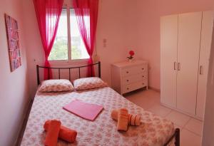 A bed or beds in a room at Stavrini's House