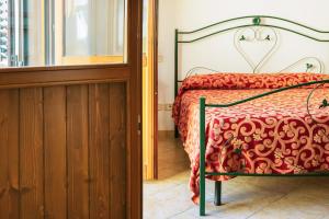 Uma cama ou camas num quarto em I Leoncini