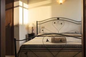 Uma cama ou camas num quarto em I Leoncini