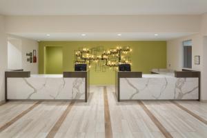 an empty lobby with a chandelier in a building at Residence Inn by Marriott Ontario Rancho Cucamonga in Rancho Cucamonga