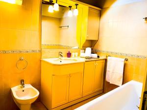 a bathroom with a sink and a toilet and a tub at Charming Bellagio in Bellagio