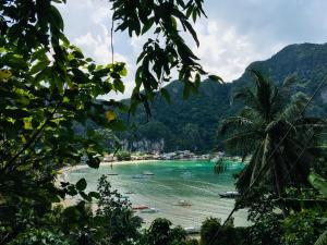 a view of a beach with boats in the water at Camp Talusi Hilltop Overlooking in El Nido