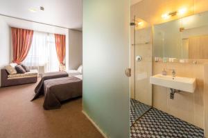Postel nebo postele na pokoji v ubytování Mini-hotel People