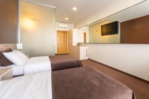 Postel nebo postele na pokoji v ubytování Mini-hotel People