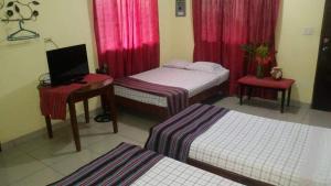 Postelja oz. postelje v sobi nastanitve Hotel & Hostal Yaxkin Copan