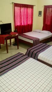 Postelja oz. postelje v sobi nastanitve Hotel & Hostal Yaxkin Copan