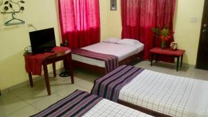 Postelja oz. postelje v sobi nastanitve Hotel & Hostal Yaxkin Copan