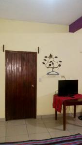 TV in/ali zabaviščno središče v nastanitvi Hotel & Hostal Yaxkin Copan