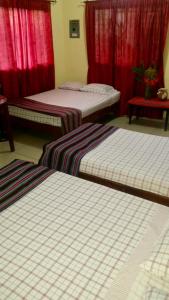 Postelja oz. postelje v sobi nastanitve Hotel & Hostal Yaxkin Copan