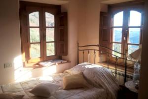 Tempat tidur dalam kamar di Villa Armonia