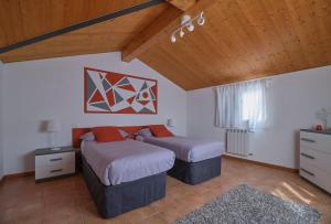 Un pat sau paturi într-o cameră la Villino Adelaide