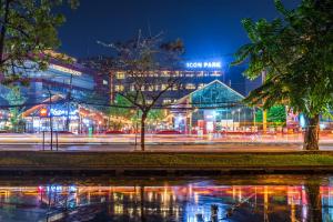 a city lit up at night with lights at Icon Park Hotel, Chiang Mai in Chiang Mai +158 photos