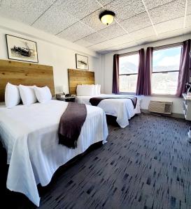 A bed or beds in a room at Hotel Nevada & Gambling Hall