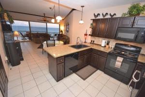 a kitchen with a sink and a counter top at 2BR 2 BA Sonoran Sea 407-E in Puerto Peñasco