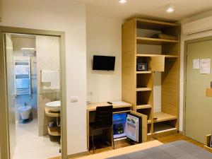 TV a/nebo společenská místnost v ubytování Hotel Liane Riccione