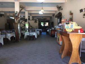 a dining room with tables and white tablecloths at Pousada Recanto de Minas in Nova Viçosa +29 photos