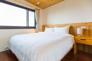 Letto o letti in una camera di Post-mountain view