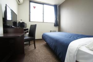 Voodi või voodid majutusasutuse HOTEL LiVEMAX BUDGET Gunma Numata toas