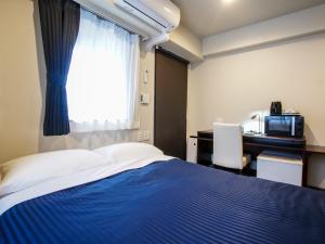 Postel nebo postele na pokoji v ubytování HOTEL LiVEMAX Umeda Doyama + 11 fotografií