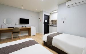 Postel nebo postele na pokoji v ubytování Malu Hotel Suwon + 37 fotografií