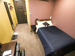 Voodi või voodid majutusasutuse HOTEL LiVEMAX Mikawaanjo Ekimae toas