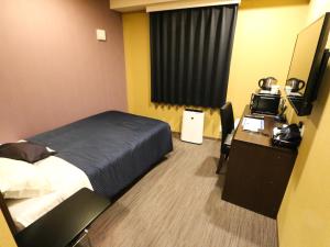 Voodi või voodid majutusasutuse HOTEL LiVEMAX Mikawaanjo Ekimae toas